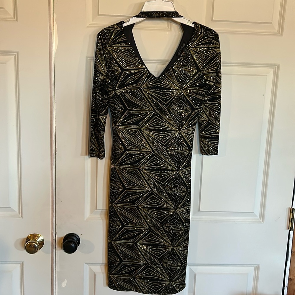 Size S black dress with gold embellishments. Non smoking home